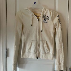 Cream colored Small Hollister zip up jacket